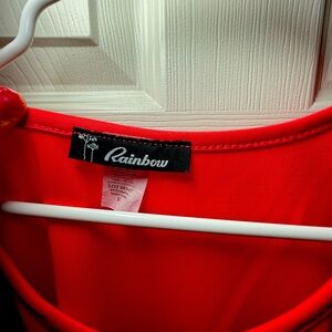 beautiful asymmetrical top/ Color is coral.